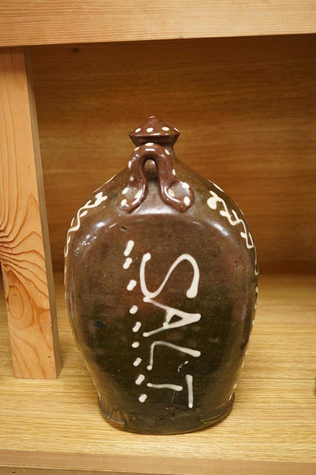 A slipware pottery salt jar, 27cm high